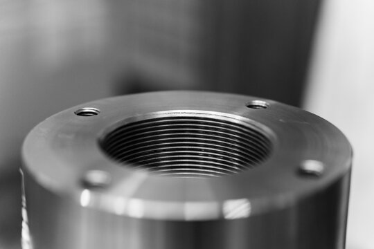 Close-Up Of Threaded Metal Component Showing Precision Engineering And Industrial Machining Detail