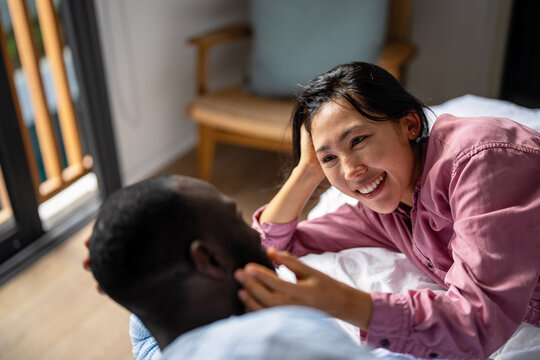 Happy diverse couple enjoying meaningful moments together, embracing love, connection, and joy - Powered by Adobe