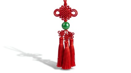 Obraz premium Elegant Jade Pendant with Red Tassels Symbolic Decoration on a White Backdrop