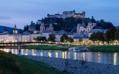 Salzburg - The panorama of old town from the river side at dusk.