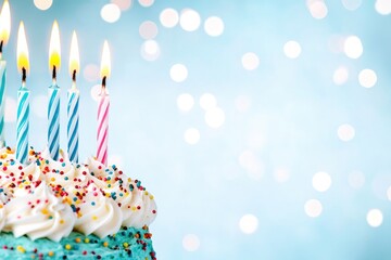 close-up birthday cake with candles on blue bokeh background and blank space for greeting card banner design