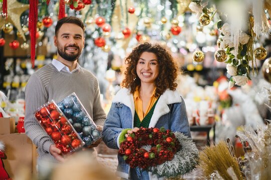 Happy couple buying christmas ornaments and decorations
