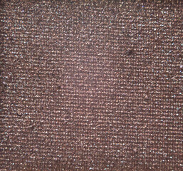 Pink eyeshadow surface in high-detail close-up photography