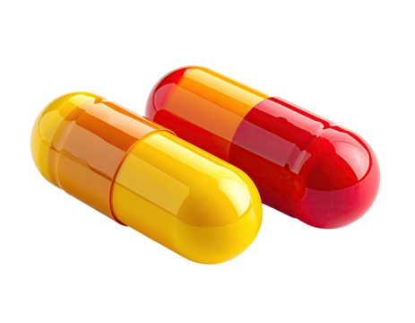 Two colorful capsules, orange & yellow, against black