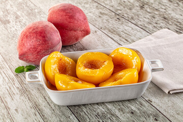 Sweet ripe yellow canned peaches