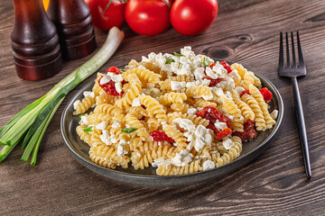 Italian pasta fusili with curd