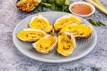 Baked oyster with cheddar cheese