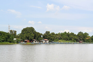 A riverside community on a cloudy day in Thailand