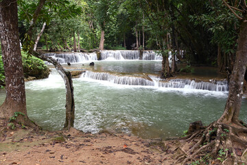 Amazing waterfall in the tropical forest of a national park in Thailand.Beauty in nature.