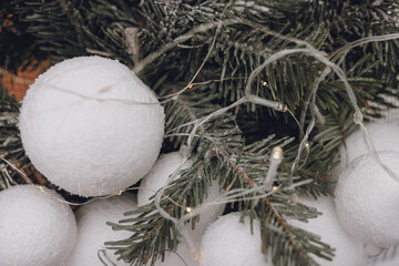 white snow on a christmas tree. christmas decorations. winter holiday concept. new year 's christmas. winter background. christmas tree. winter holidays