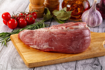 Raw pork sirloing over board