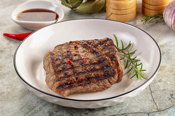 Grilled juicy beef steak with pepper