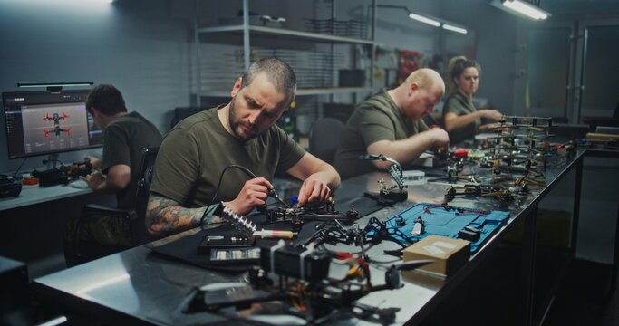 Modern Manufacturing Facility Bustles With Skilled Workers Various Stations, Building FPV Drones. Concept of Precision and Complexity of Modern Industrial Production and Technological Advancement.