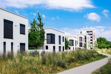 Residential Apartment Building with City Landscape. New Modern Stylish Low-rise Multifamily...