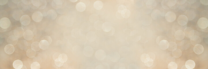 Elegant panoramic christmas banner 1x3 with defocused twinkling lights in beige tones