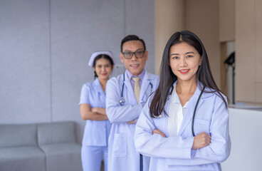Fototapeta premium portrait professional doctor team standing crossed arms in aesthetic clinic with copy space for text