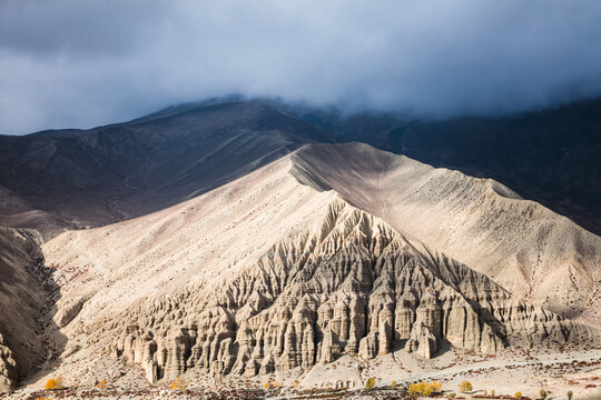 Mountains and valley with dark clouds, Upper Mustang region, Nepal