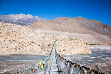 Suspension bridge over valley, Upper Mustang region, Nepal