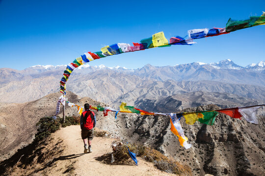 Man relaxing on mountain high pass, Upper Mustang, Nepal