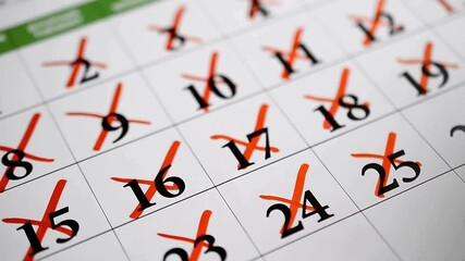 Marked Calendar Days Close-Up View with Red Crosses Emphasizing Past Events