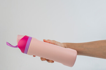 Hand holding cup cold storage. Tumbler glass cold store. on white background.