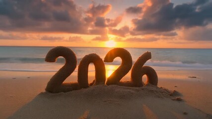 “2026” sculpted in sand on beach with dramatic sunset and ocean in background, warm glow and long shadows across sand, vibrant sky with orange, pink, and purple clouds, symbolic and serene.