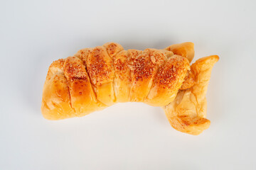 Baked bread stuffed with chicken sausage on white background