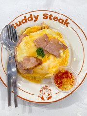 creamy omelet or omelet or omelette or fried egg with ham and green onion for serve
