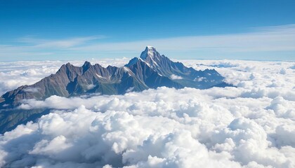 Fototapeta premium Majestic mountain peaks piercing a boundless expanse of fluffy white clouds, perspective, above