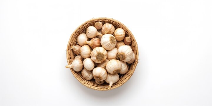 Top-down view of a woven basket containing garlic cloves and shallots, emphasizing texture contrast for culinary preparation