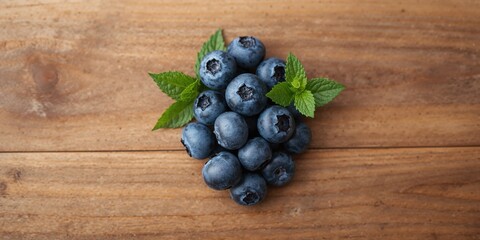Fototapeta premium Fresh organic blueberries on wooden surface, emphasizing healthy vegetarian ingredients for summer diets