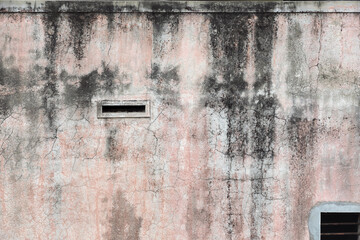 Old weathered cement wall with crack