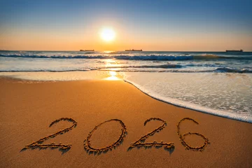 Selbstklebende Fototapeten Sportgeschäft Happy New Year 2026 concept, lettering on the beach. Sea sunrise  © ValentinValkov