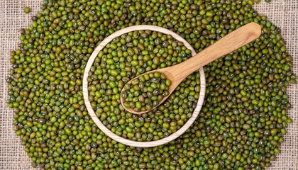 Top View of Green Mung Beans in a Bowl with Wooden Spoon.