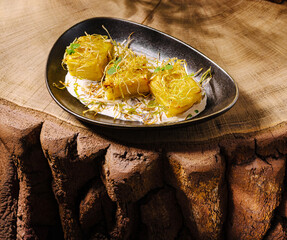 Delicious plated dish of crispy treats served on a rustic wooden surface