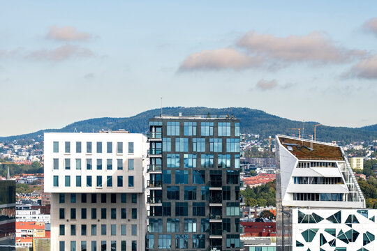 Architecture skyline oslo barcode mountains urban cityscape reflections geometry business district modern facade reinforcing commercial potential across Oslo&rsquo;s contemporary skyline