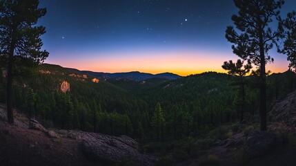 Colorful twilight sky over peaceful mountain landscape with layered hills
