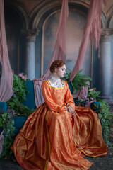 A red-haired girl in a medieval outfit at a ball in a castle interior