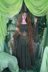 An elven story. A girl with long hair in a magical forest studio