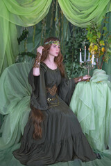 An elven story. A girl with long hair in a magical forest studio