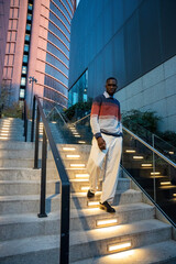 Evening stroll down modern stairs in a vibrant urban setting