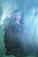 An elven story. A girl with long hair in a magical forest studio