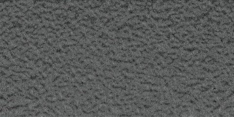 Fototapeta premium Close-up macro view of a uniform, granular dark gray textured surface with a consistent, rough, and matte finish, ideal for industrial or abstract backgrounds