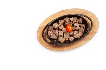 Meat casserole in a cast iron pan.  Turkish Kavurma.