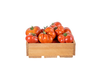 Wooden crate filled with ripe red oxheart tomatoes, heirloom variety grown in a home garden. Fresh organic harvest isolated on transparent background