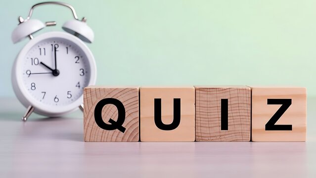 White Alarm Clock and Wooden Blocks Spelling QUIZ image photo