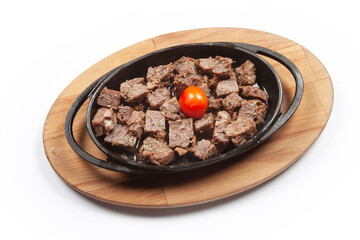 Meat casserole in a cast iron pan.  Turkish Kavurma.