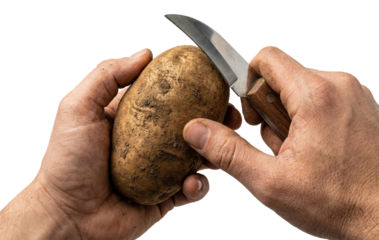 Male hands peeling raw dirty potato with small knife isolated on white background