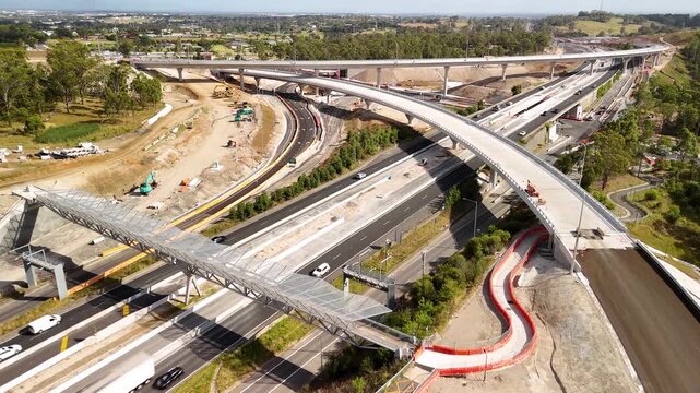 Aerial drone view above the M7-M12 Interchange at Cecil Hills, Western Sydney, NSW Australia on a sunny morning in December 2025