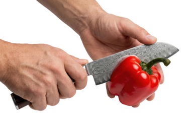 Male hands slicing fresh red bell pepper with damascus steel knife